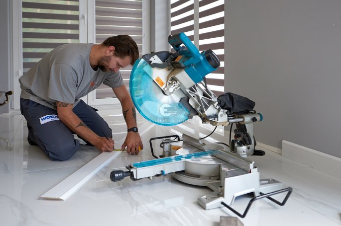 Installation of skirting boards.